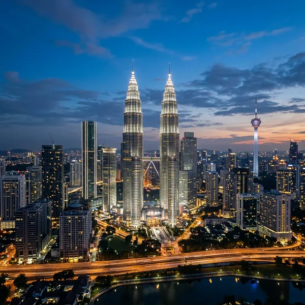 Petronas Twin Towers and Kuala Lumpur skyline at dusk